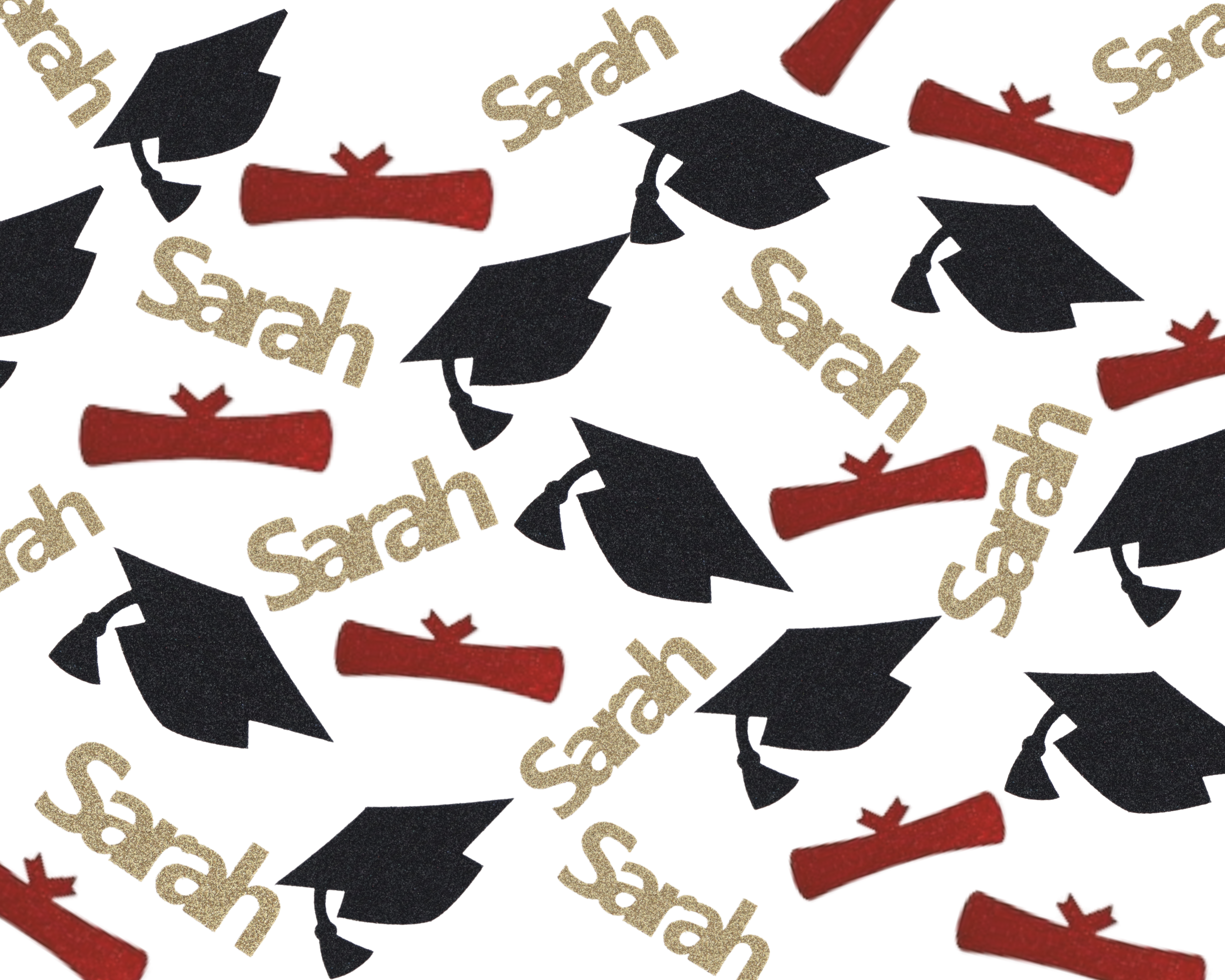 Personalized graduation confetti with name cap and diploma design scattered on table